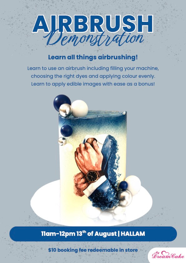 Promotional flyer for an airbrush demonstration event at HALLAM, featuring a decorated cake with blue and white icing, silver and white pearls, and text detailing the event from 11am-12pm and 13th of August.